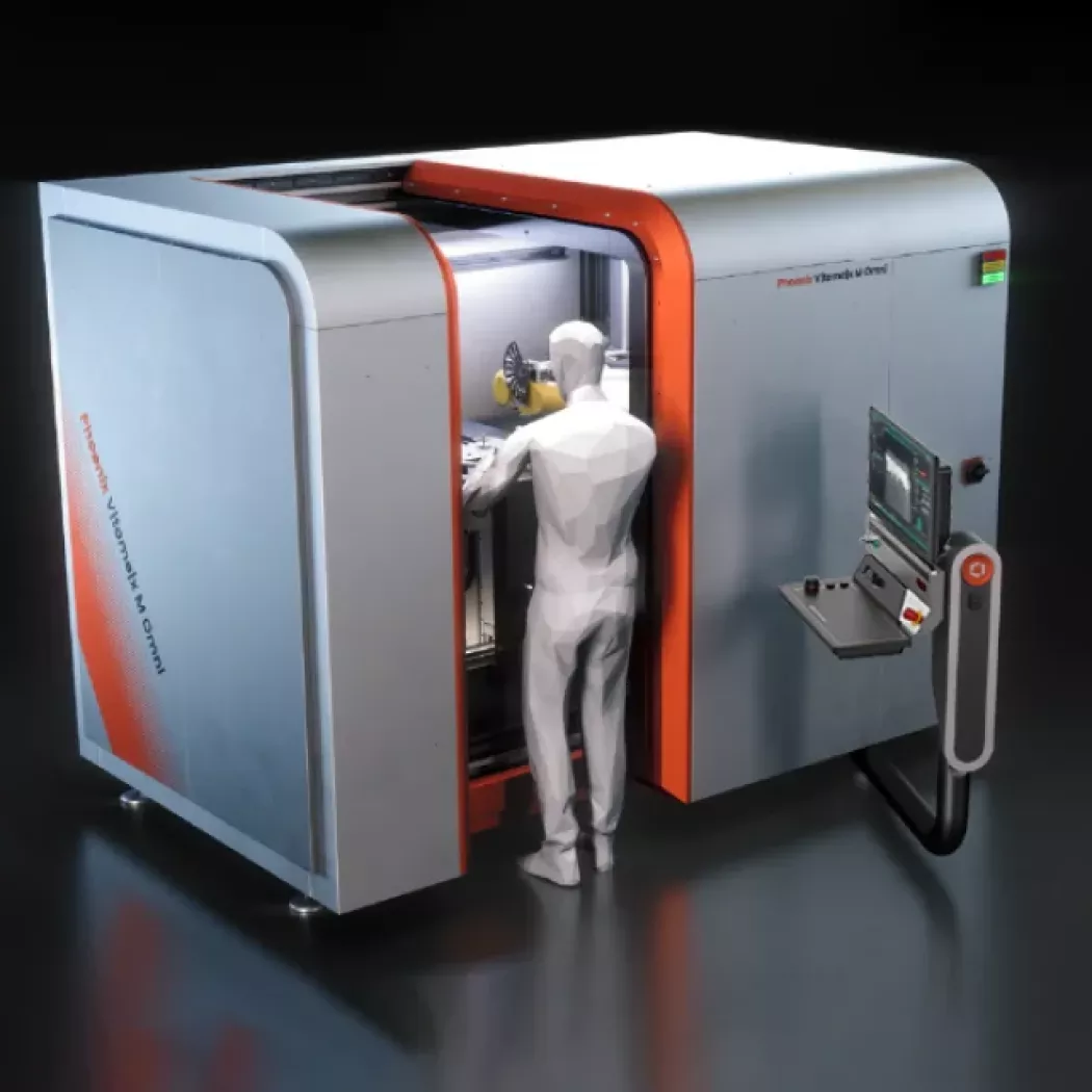 Operator przy mikrotomografie Phoenix V|tome|x M NEO podczas obsługi urządzenia